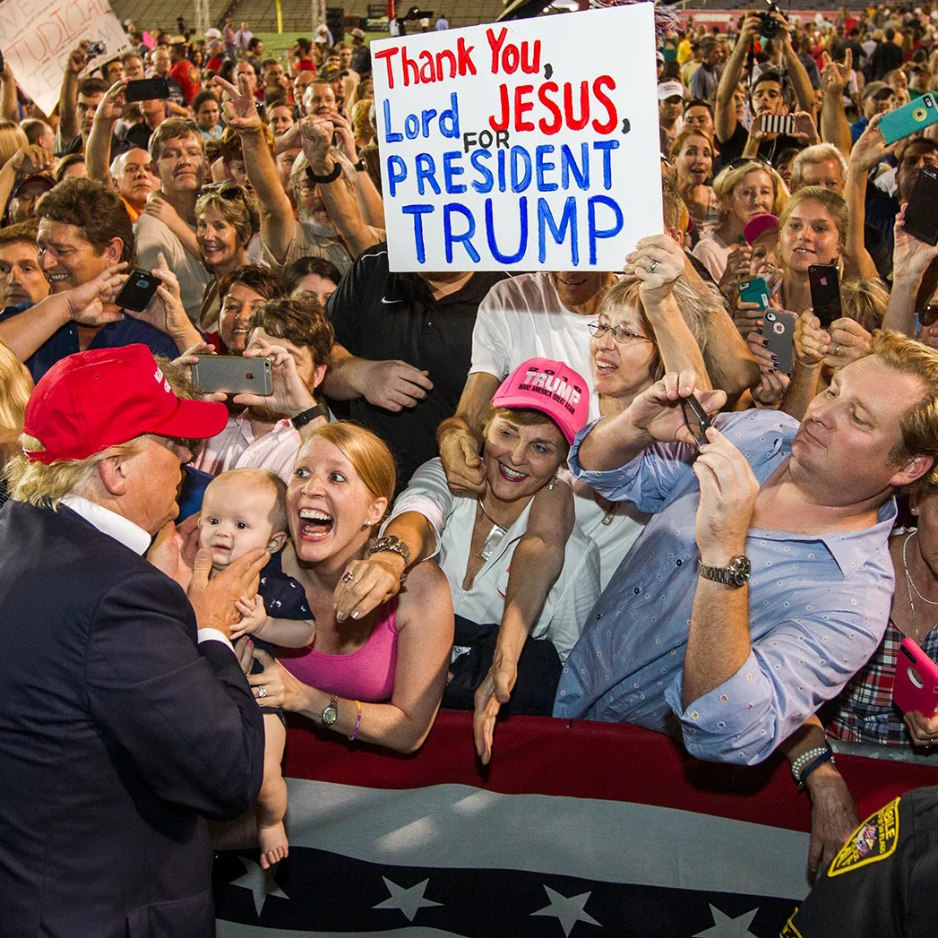 Donald Trump facing crowd of wide-eyed open mouthed supporters